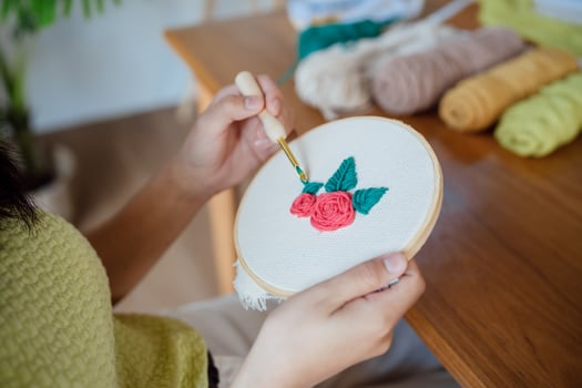 Punch needle. Asian Woman making handmade Hobby knitting in studio workshop. designer workplace Handmade craft project DIY embroidery concept. photo