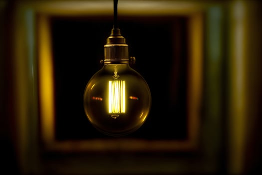 A Light Bulb Hanging From A Ceiling In A Room. photo