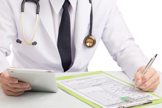 Doctor record history or filling medical form. photo