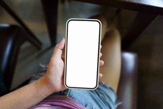 Close up of women's hands holding cell telephone blank copy space screen. smart phone with technology concept photo