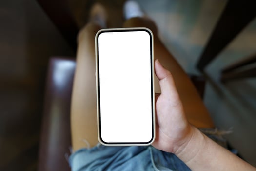 Close up of women's hands holding cell telephone blank copy space screen. smart phone with technology concept photo