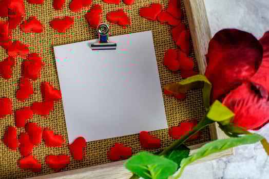 Valentines day background. Red rose with message card of Love romantic couple. photo