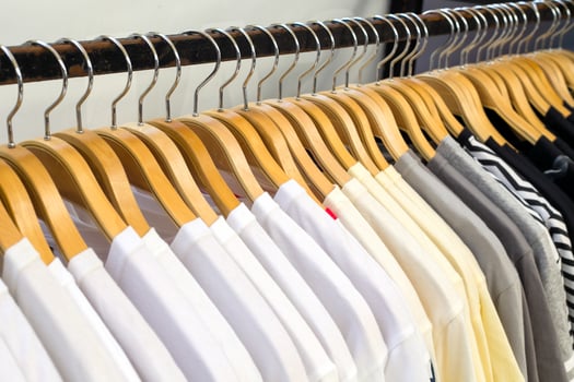 Close up white shirt hanging in wardrobe. photo