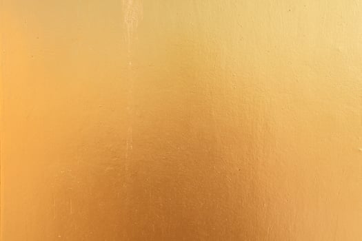Gold concrete wall on background texture. photo