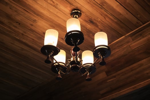 Vintage chandelier hanging on ceiling wooden. photo