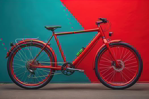 Red bicycle on the background of a colored wall, close-up. photo