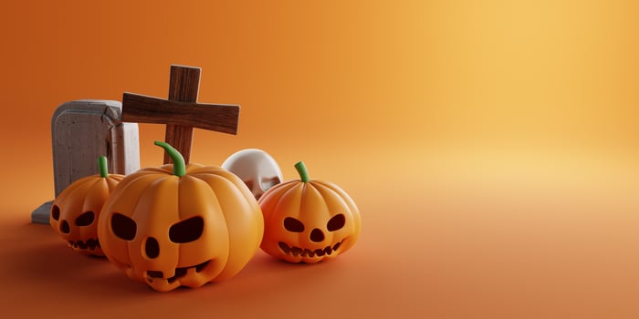 3d Rendering. Design for Halloween banner with pumpkin,crucifix, skull, grave on a orange background. With copy space. photo