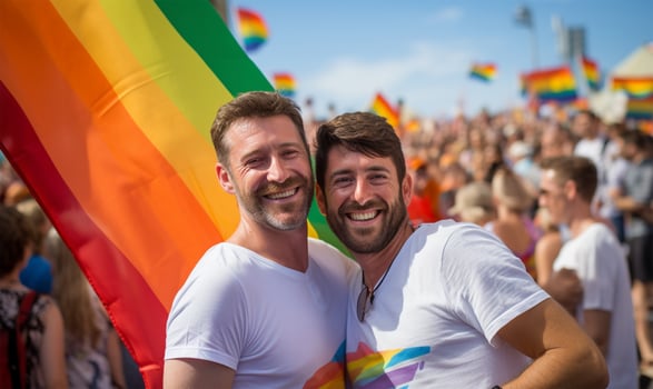 Two men with LGBT flags at the gay pride demonstration. photo