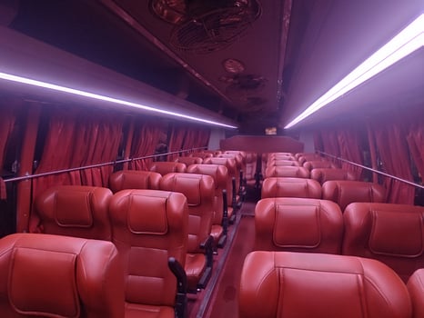 Deep red color interior of travel bus with lighting effect.Tourist bus seat Interior lighting. photo