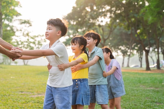 group image of cute asian children playing in the park photo