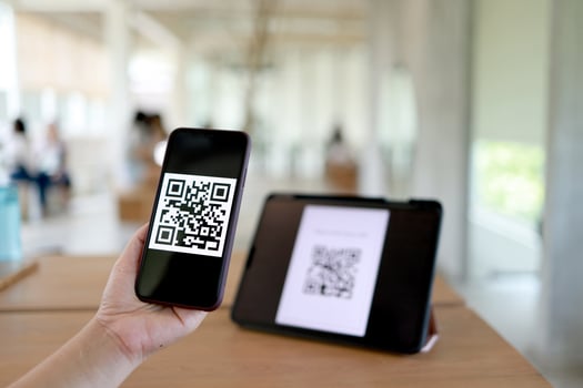 Qr code payment. Woman scanning QR code online shopping cashless technology concept. photo