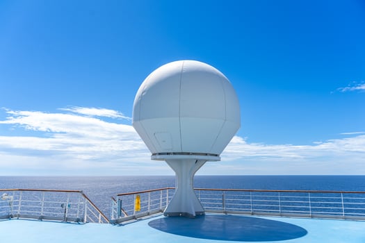 white antennas, radar and other communication and navigation equipment on the mast of ship photo