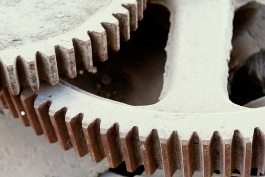 Stack of big and dirty industrial gear wheels. Giant iron gears photo