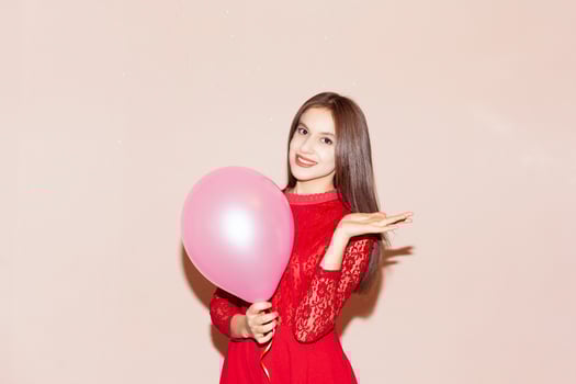 pretty woman holds air balloon. valentines day, birthday, womens day, anniversary, holiday celebration concept photo