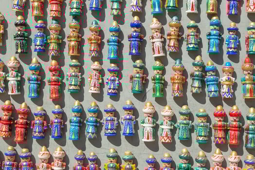 Bukhara, Uzbekistan - March 13, 2019 Colourful handmade ceramic figures selling at street shop in Bukhara, Uzbekistan photo