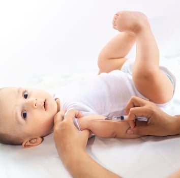 Doctor vaccinating a newborn baby boy. Child's Immunization, Children's Vaccination, Health concept. photo