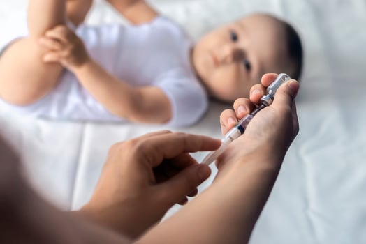 Doctor vaccinating a newborn baby boy. Child's Immunization, Children's Vaccination, Health concept. photo