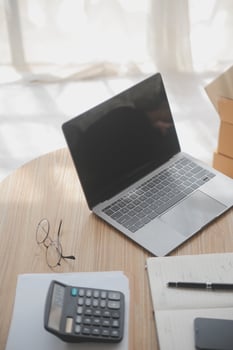 Woman small business owner, business start up conceptual, young entrepreneur work with laptop sell product on line shop, banner wide dimension photo