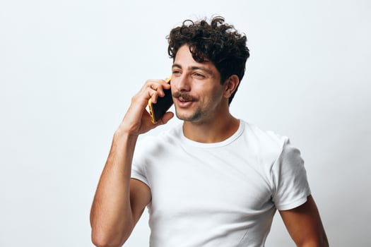 Beard man message young phone portrait t-shirt mobile online white lifestyle hipster technology smart photo