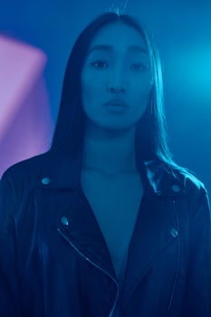 Woman art concept purple colourful light trendy portrait neon face hair blue photo