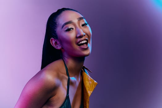 Trendy woman elegant light colorful disco blue beauty fashion neon purple photo
