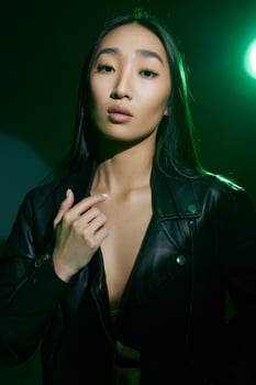 Woman neon dark art concept stylish trendy yellow green light colourful blurred smoke portrait photo