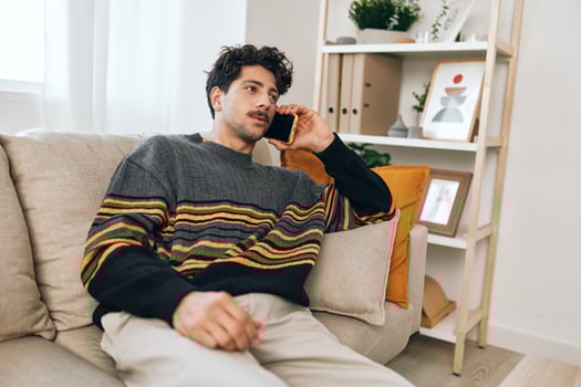 Man lifestyle phone cell couch home smile photo