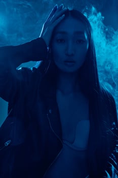 Woman colourful neon purple trendy blue portrait concept photo