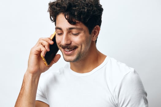 T-shirt man portrait phone technology hipster online looking message male adult lifestyle white photo