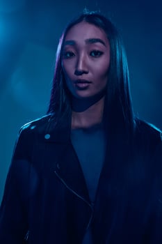 Woman concept trendy colourful neon purple blue portrait photo