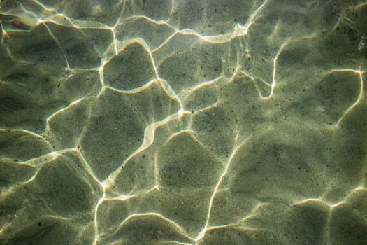 Reflections of light on the waves of the sea photo