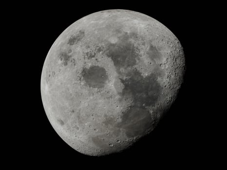 Moon surface full moon super moon close up in the night. Detail of the lunar surface in black photo