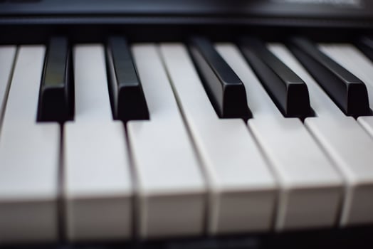 Close-up of piano keys. Piano black and white keys and Piano keyboard musical instrument placed at the home balcony during sunny day. photo