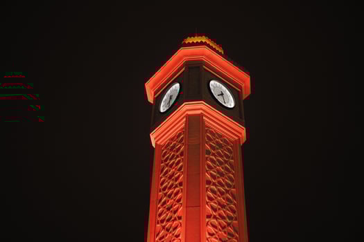 old clock tower at night in istanbul photo