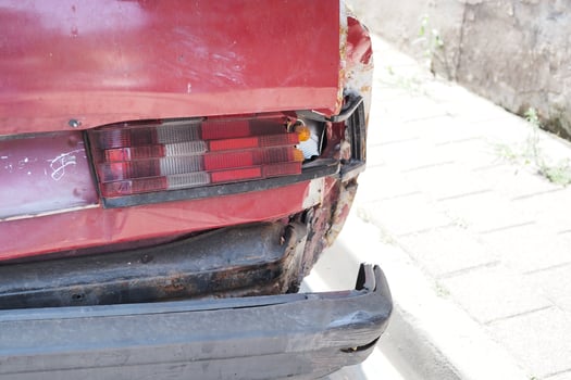 red car damaged by a road accident photo