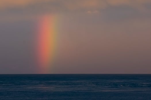 rainbow over the ocean photo