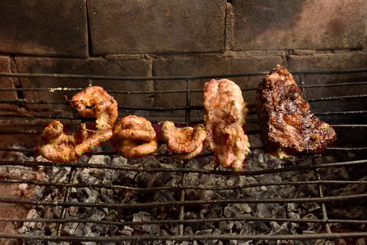 Cow bowels presented on a grill. Argentine Traditional cuisine. photo