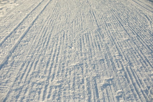 Ski track in winter. Place for winter sports. Prepared ski slope. photo