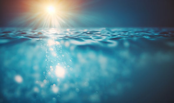 Glistening Blue Water Surface with Sunlight Reflections in Swimming Pool photo