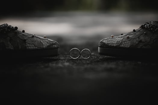 two wedding rings on a black background photo