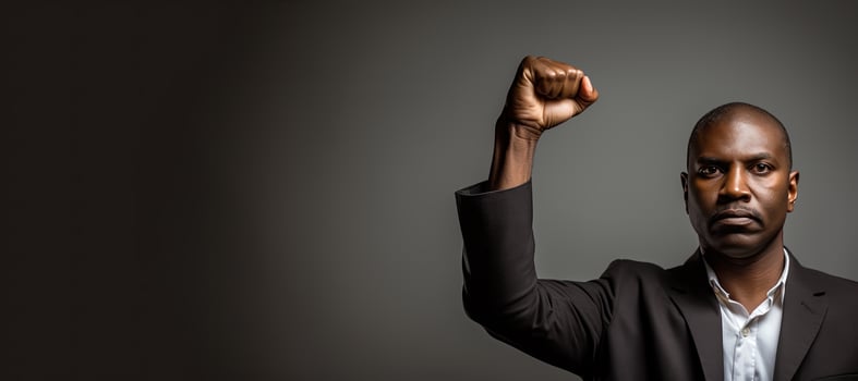 African American male employee clenching his fist with copy space. AI Generated photo