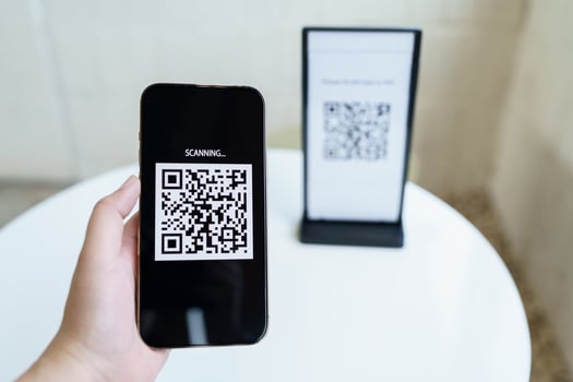 Qr code payment. E wallet. Man scanning tag accepted generate digital pay without money.scanning QR code online shopping cashless payment and verification technology concept. photo