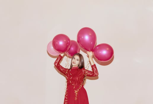 happy and beautiful woman holds air balloons. valentines day, birthday, womens day, anniversary, holiday celebration concept photo