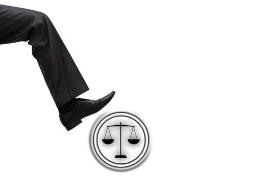 man stomping justice icons, man tramples justice photo