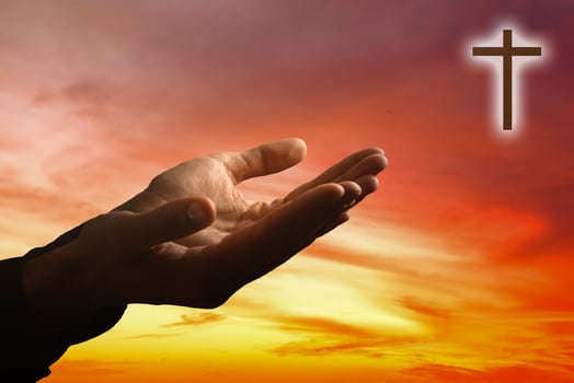 Hands of a man reaching to towards sky photo