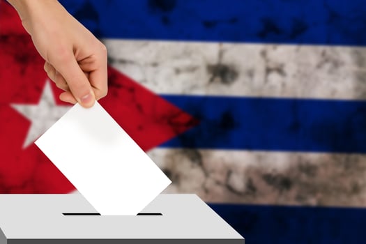 hand drops the ballot election against the background of the flag, concept of state elections, referendum photo