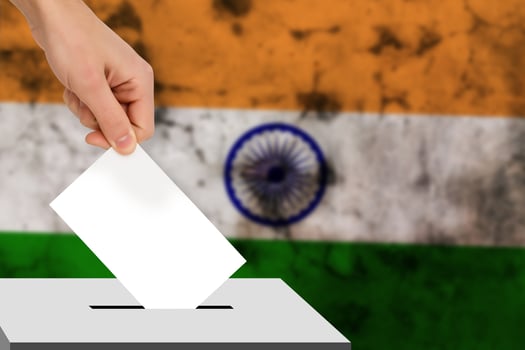 hand drops the ballot election against the background of the flag, concept of state elections, referendum photo