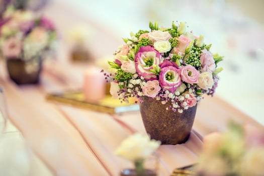 Wedding table setting. Beautiful table set with flowers and glass cups  for some festive event, party or wedding reception photo