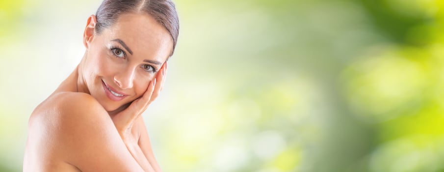 Beautiful portrait of young adult woman with clean skin without make-up. Spa skincare wellness and cosmetics concept photo