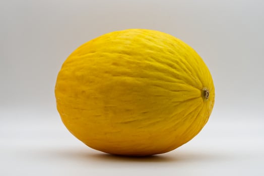 Canary yellow melon isolated on white background. photo